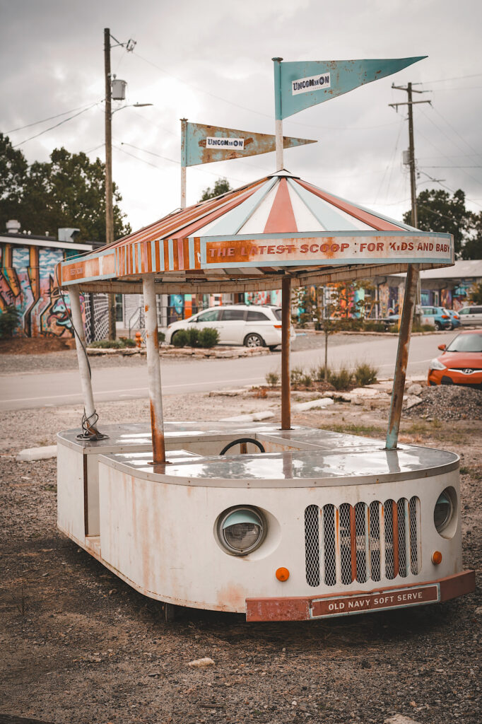 Old, vintage ice cream cart that is rusted